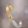 Maison Margiela Manschette mit verdrehter Nummer Maison Margiela Manschette mit verdrehter Nummer